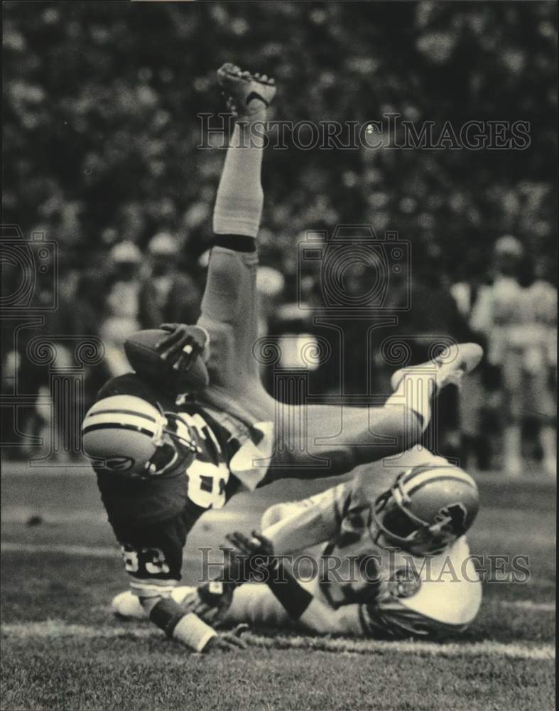 1983 Press Photo GBP football's John Jefferson survives hit by William Graham- Historic Images