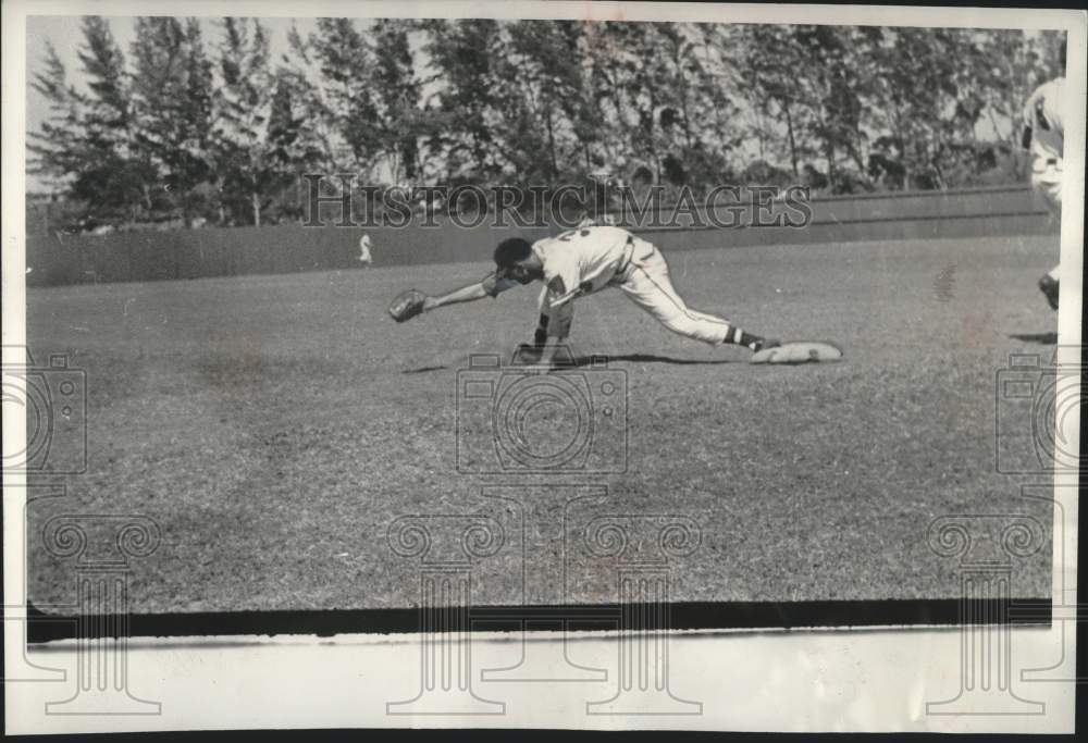 1955 Baseball player Frank Torre stretching off bass to catch a ball - Historic Images
