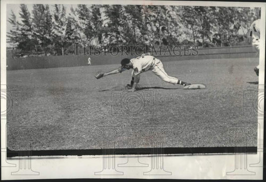 1955 Baseball player Frank Torre stretching off bass to catch a ball - Historic Images