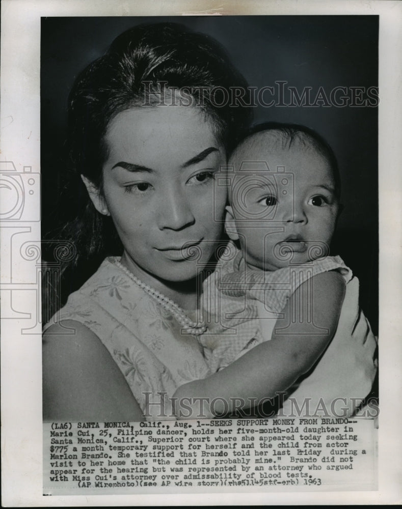 1963 Marie Cui, holds five month old daughter in CA superior court. - Historic Images