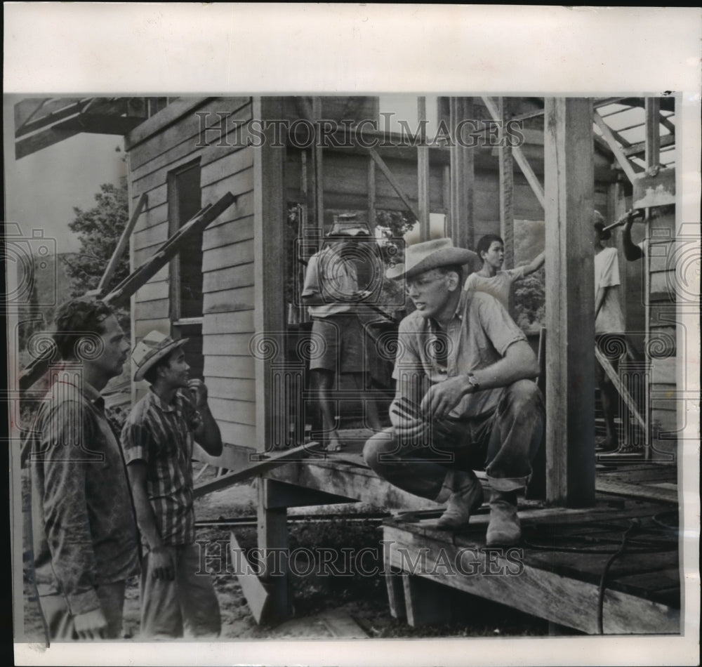 1964 American volunteer Gus Carlson supervised construction in Laos - Historic Images