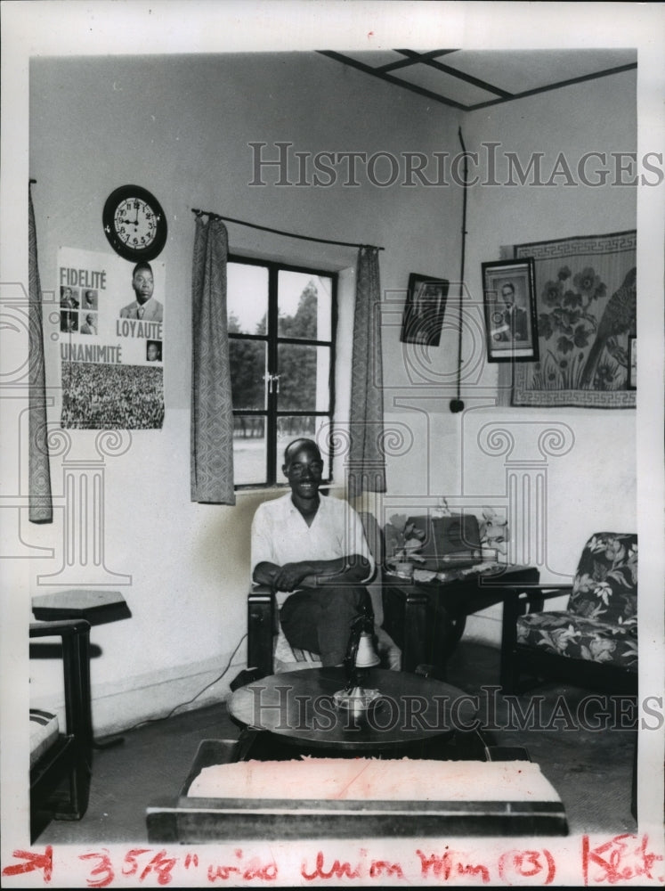 1962 Smiling African Sits In Home With Picture Of President Tshombe - Historic Images