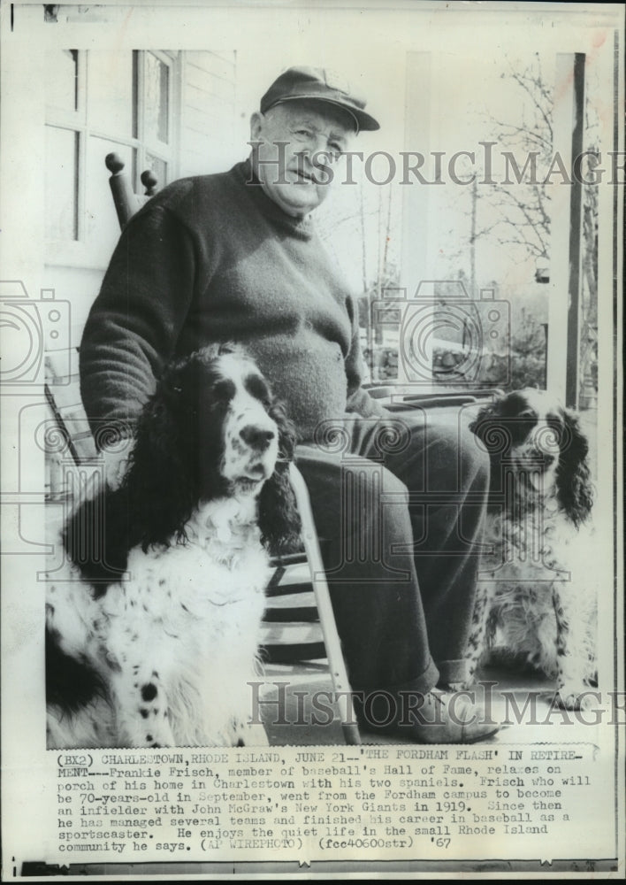 1967 Frankie Frisch on the porch of his Charleston home with dogs - Historic Images