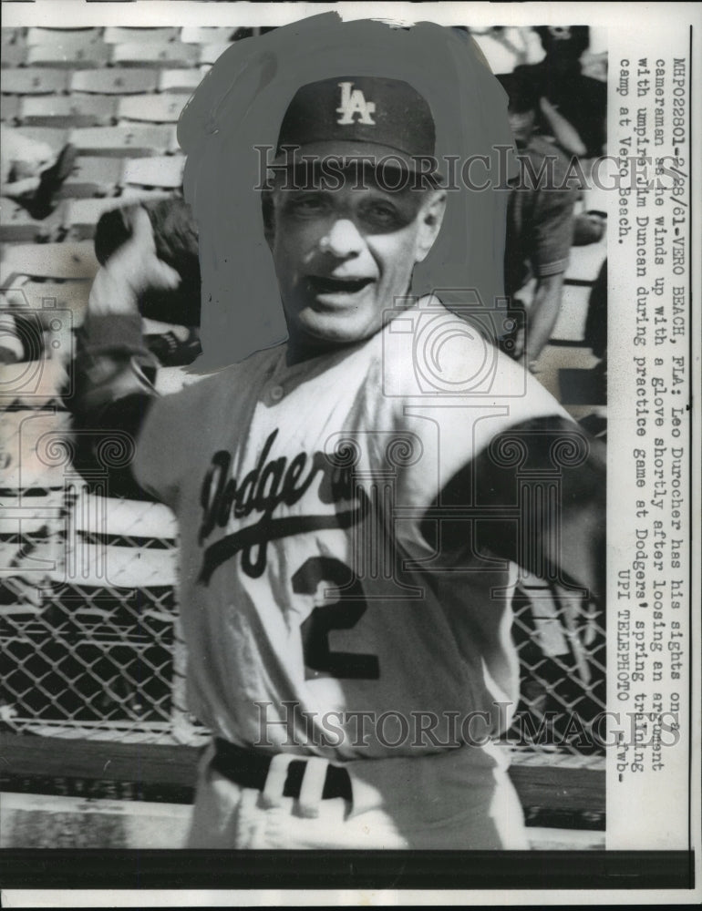 1961 Leo Durocher winds up with a glove in practice game - Historic Images