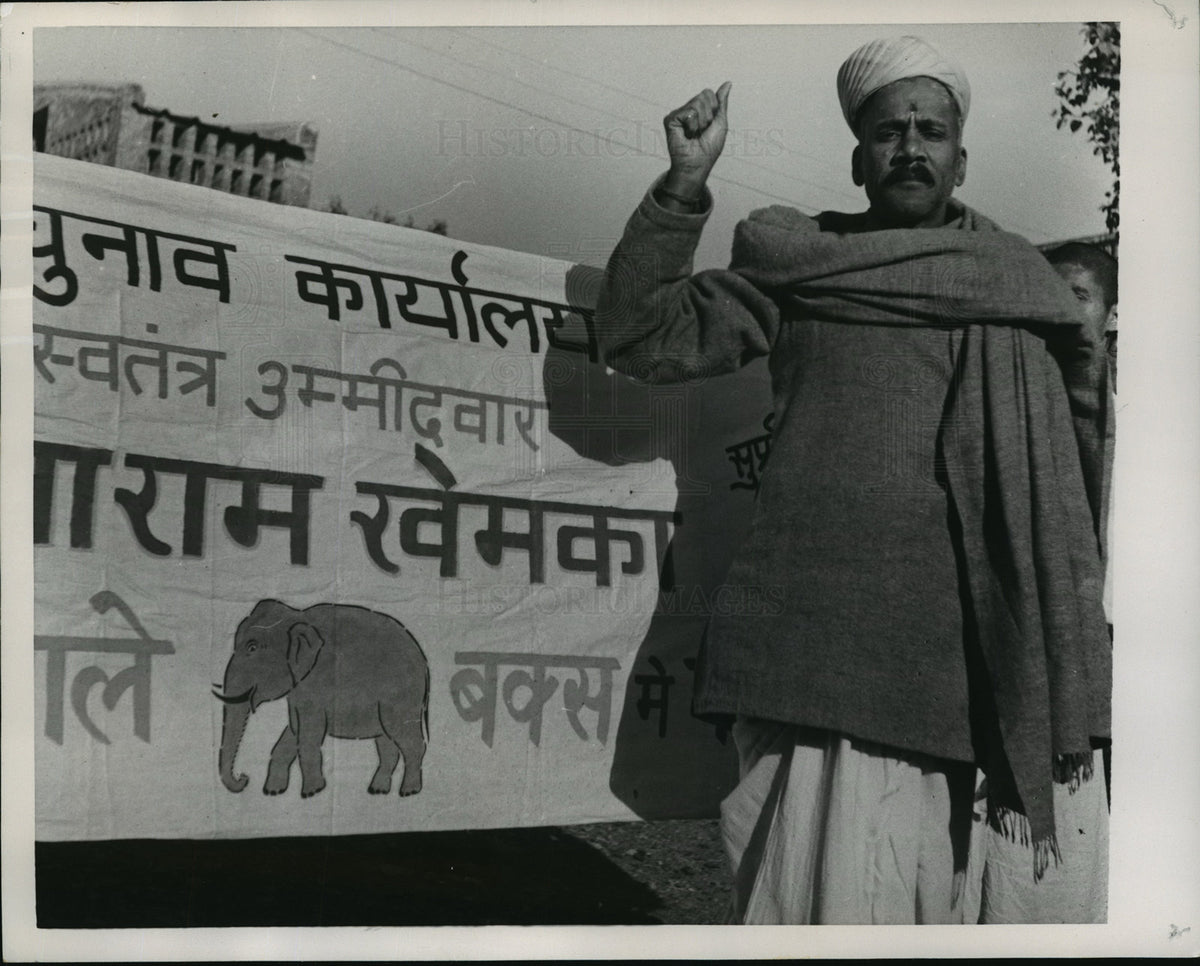 1957 Gita Ram Khemka poses with campaign poster with elephant symbol - Historic Images