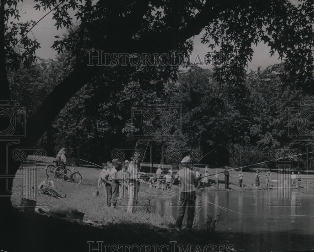1949 Crowd busy fishing with bamboo poles at Washington Park - Historic Images