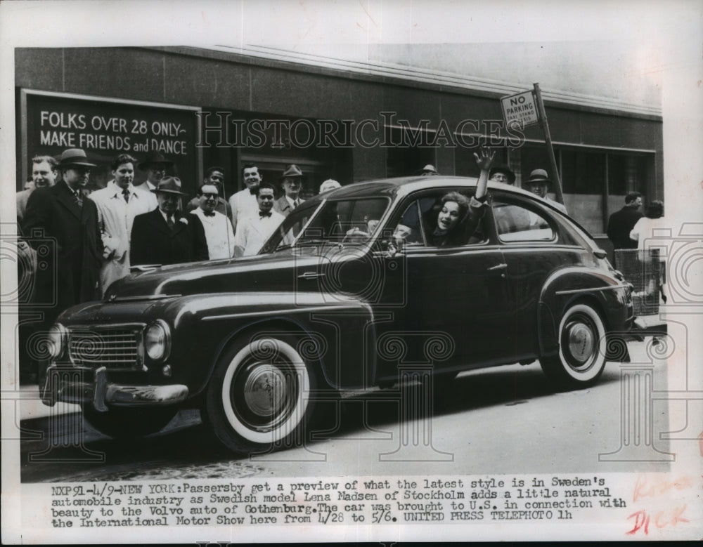 1956 Press Photo Passersby look at Volvo auto of Gothenburg driven by L. Madsen-Historic Images