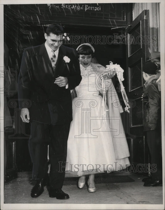 1952 Alan Ameche and his bride, Holy Rosary leave the Pompeii church-Historic Images