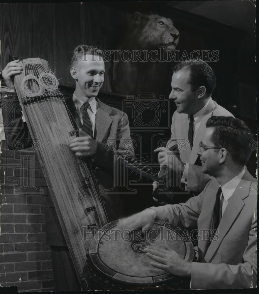 1956 Press Photo R.P. Wurlitzer and others in group play musical instruments.-Historic Images