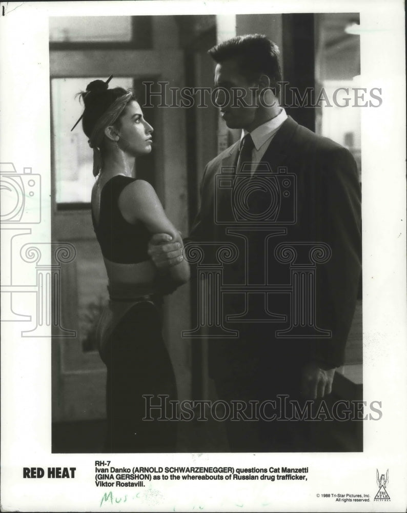 1988 Arnold Schwarzenegger and Gina Gershon in "Red Heat"-Historic Images