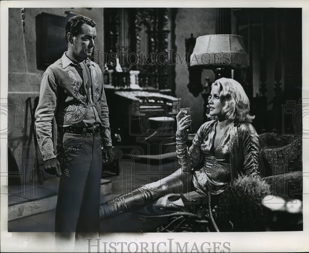 1964 Press Photo Carroll Baker and Alan Ladd in &quot;The Carpetbaggers&quot; - mjx31205-Historic Images