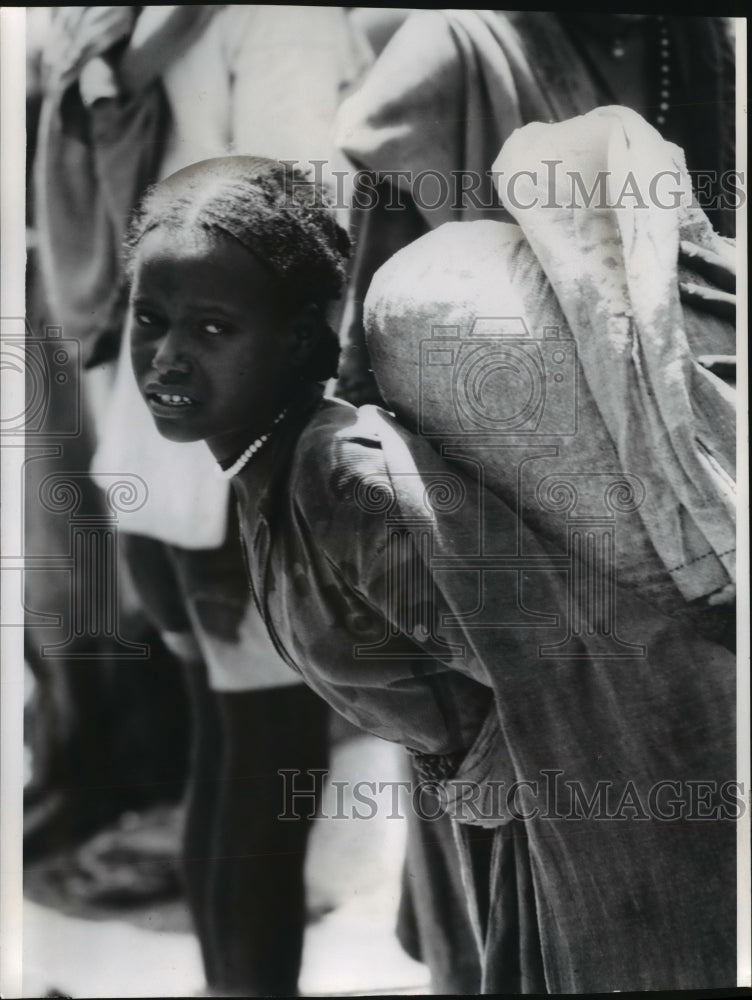 1974 Woman carrying grain from Haik distribution center, Ethiopia-Historic Images
