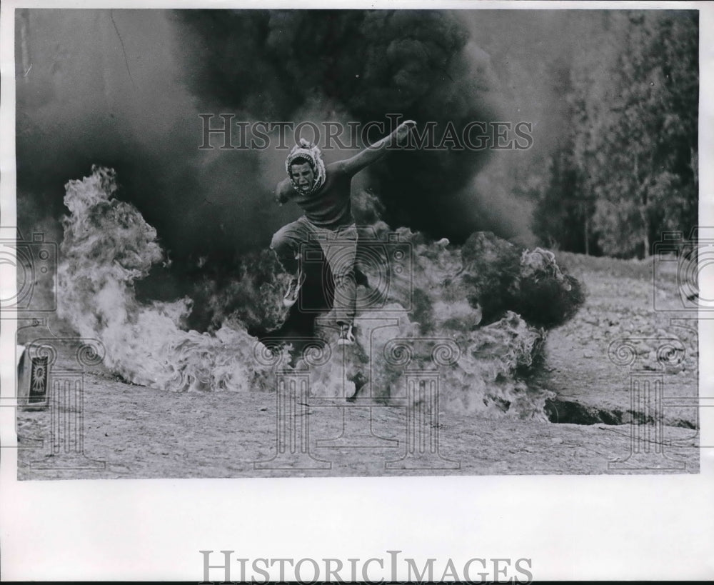 1969 Al Fatah recruit dashes through gas fire in training, Jordan-Historic Images