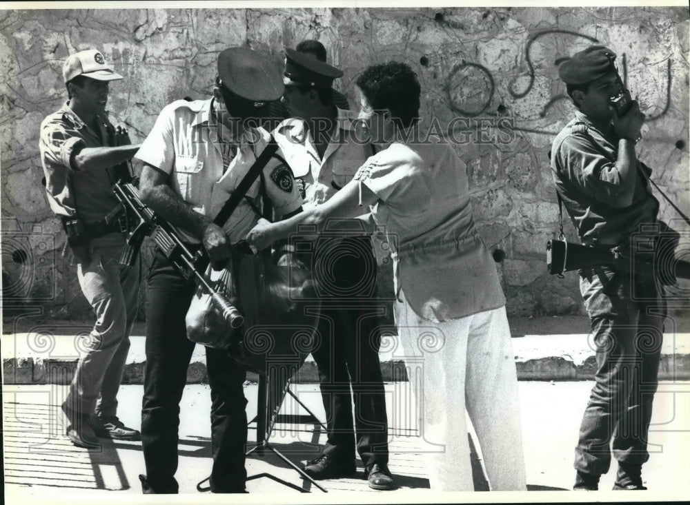 1989 Israeli police searching bags of Palestinian civilian in Israel-Historic Images