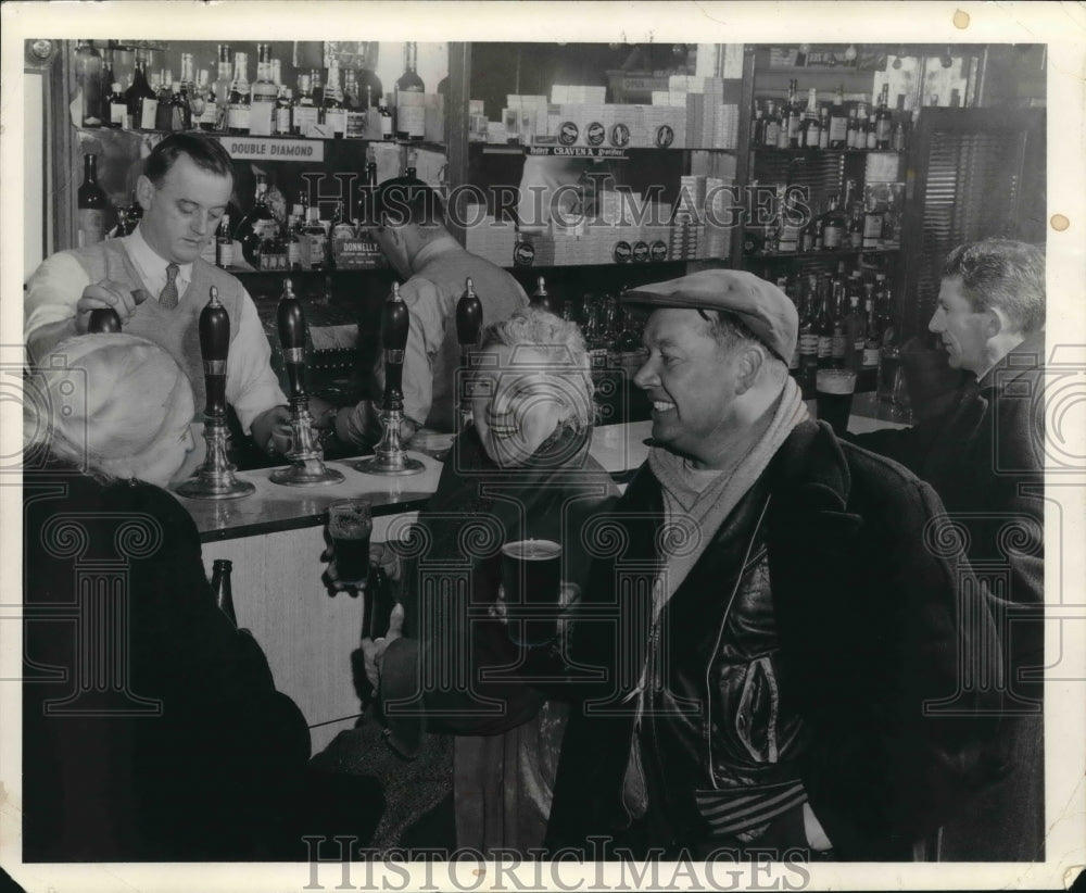1963 One of many Ireland pubs where people gather for drinks-Historic Images