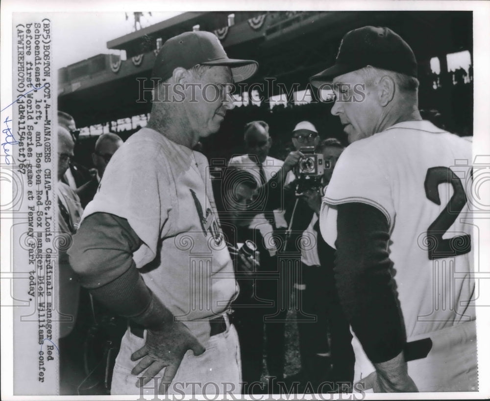 1967 Red Schoendienst and Dick Williams confer at Fenway Park. - Historic Images