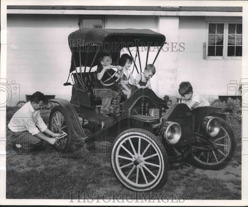 1955 Press Photo Philip W. Johnson works on his two-cylinder 1909 Demot.-Historic Images