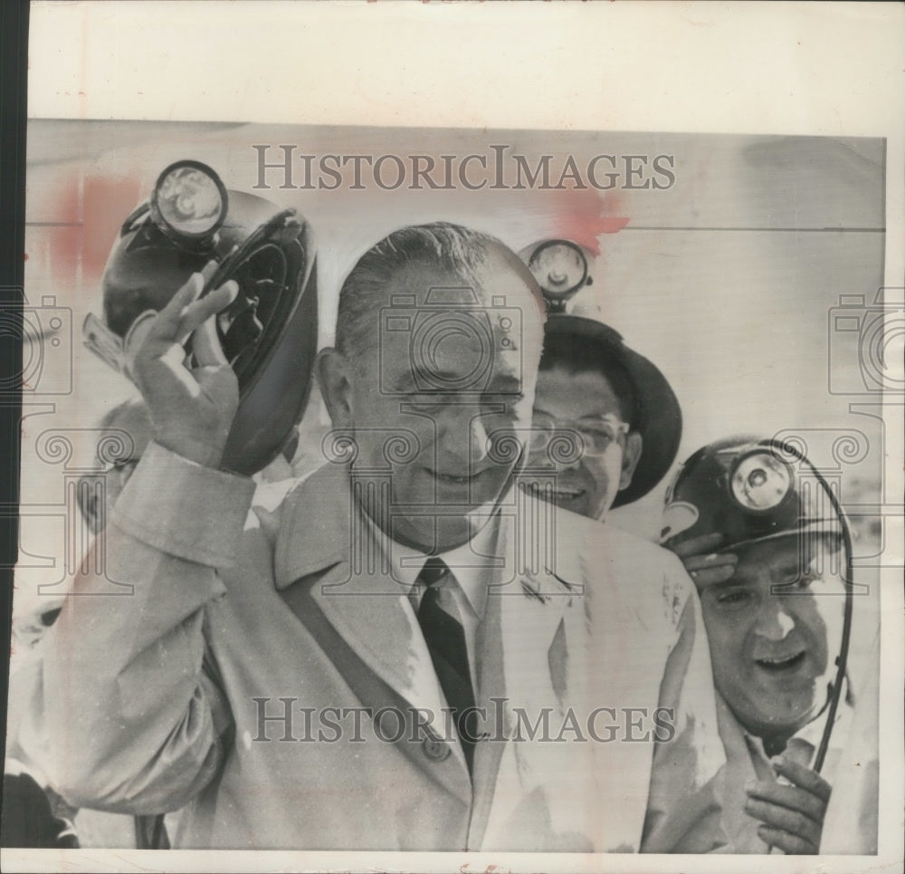 1964 Press Photo President Johnson held a miner's hard hat at Butte airport.- Historic Images