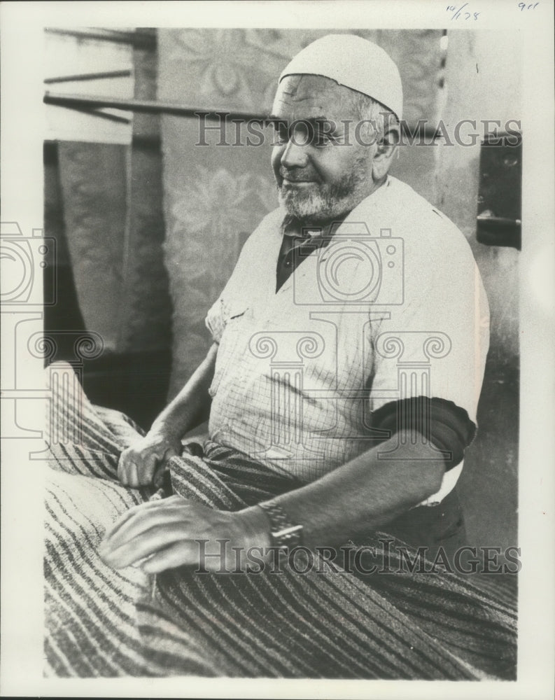 1977 Man Checks Blanket in Amman, Jordan Factory - Historic Images