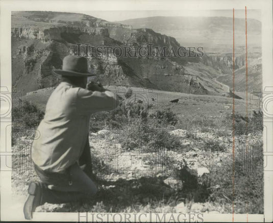 1968 Crow Indian hunter Frank He-Does-It aims for buffalo in Montana - Historic Images