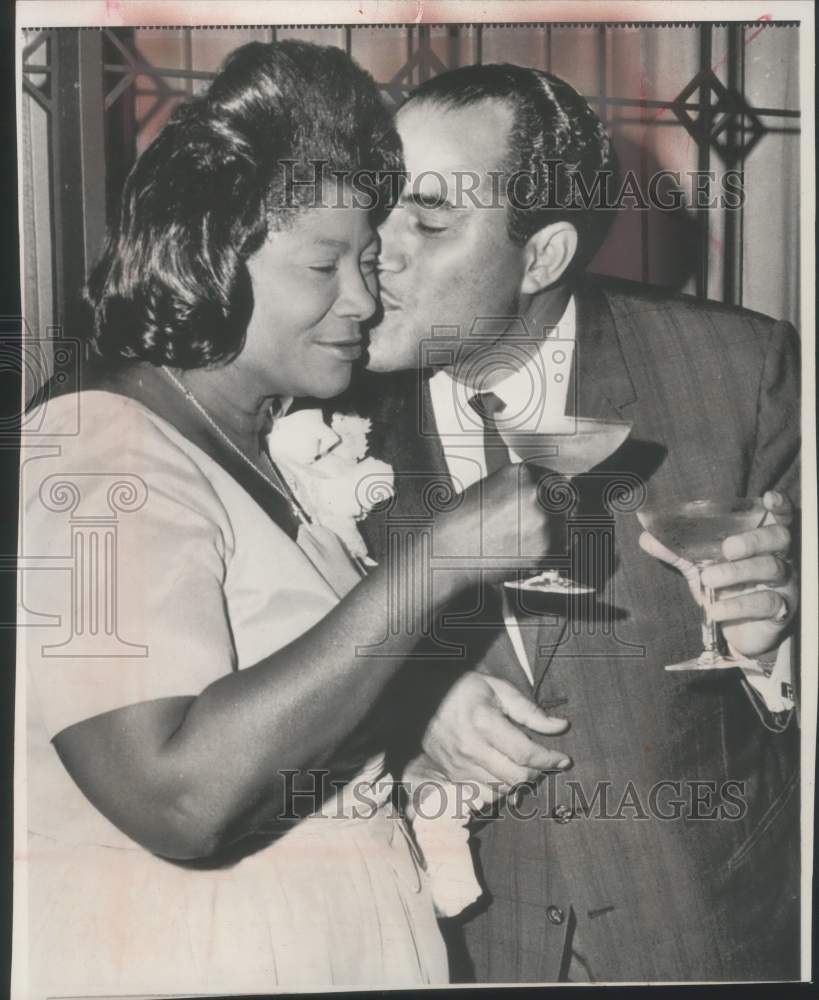1964 Singer Mahalia Jackson received a kiss from her husband.-Historic Images