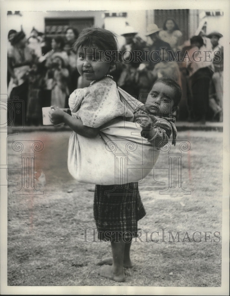 1960 Guatemalan Children get their daily ration of powdered milk - Historic Images