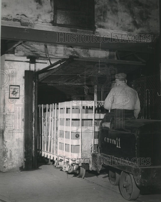 1955 Elevators lift cars at railroad line freight houses - Historic Images