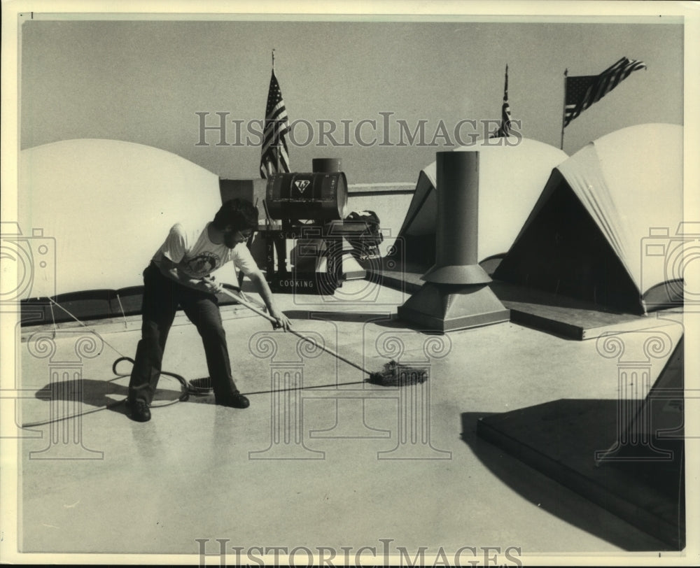 1985 Press Photo A Boy Scout mopping cement United States - mjx62622- Historic Images