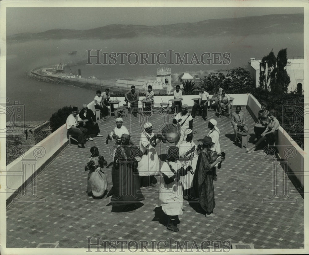 1962 Press Photo Moroccan Natives, Entertain Travelers in Tangier. - mjx65720- Historic Images