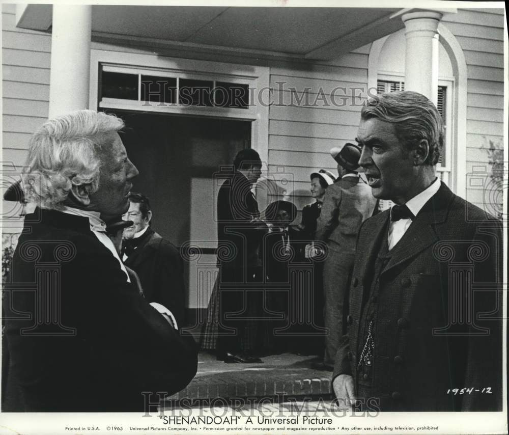 1965 James Stewart explains his tardiness to pastor in &quot;Shenandoah&quot;-Historic Images