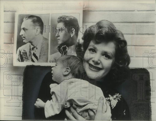 1954 Cara Williams held son beside portraits of grandfather & father-Historic Images