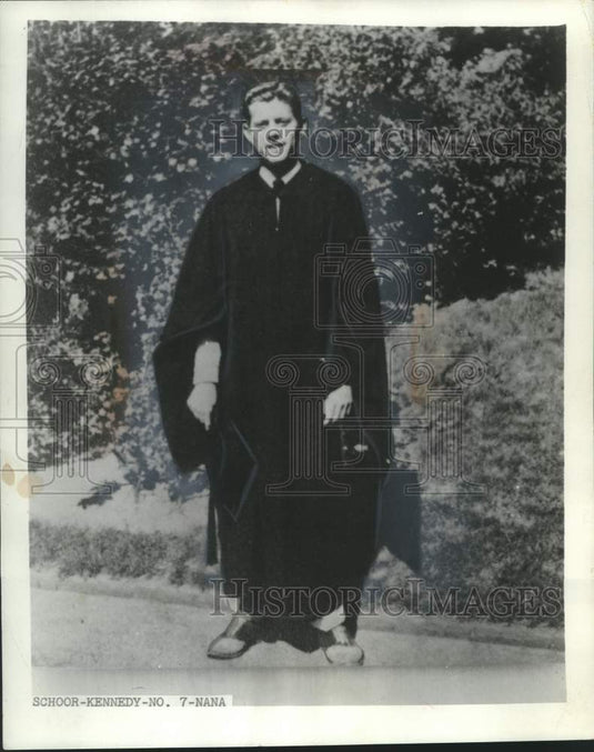 1989 Prior to graduation at Choate, Jack Kennedy tried on his robe. - Historic Images