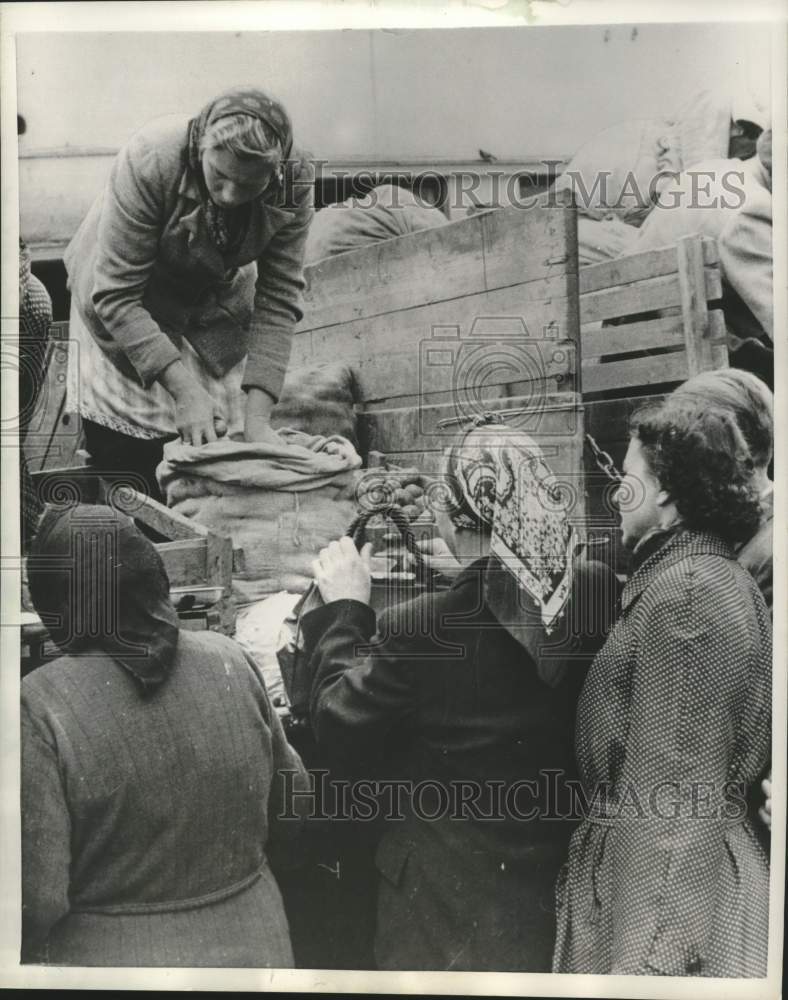 1958 Latvian housewives line up to buy produce from a truck-Historic Images