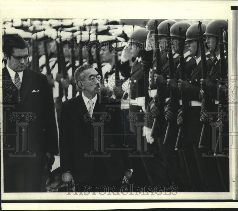 1971 West German airman at attention before Emperor Hirohito - Historic Images