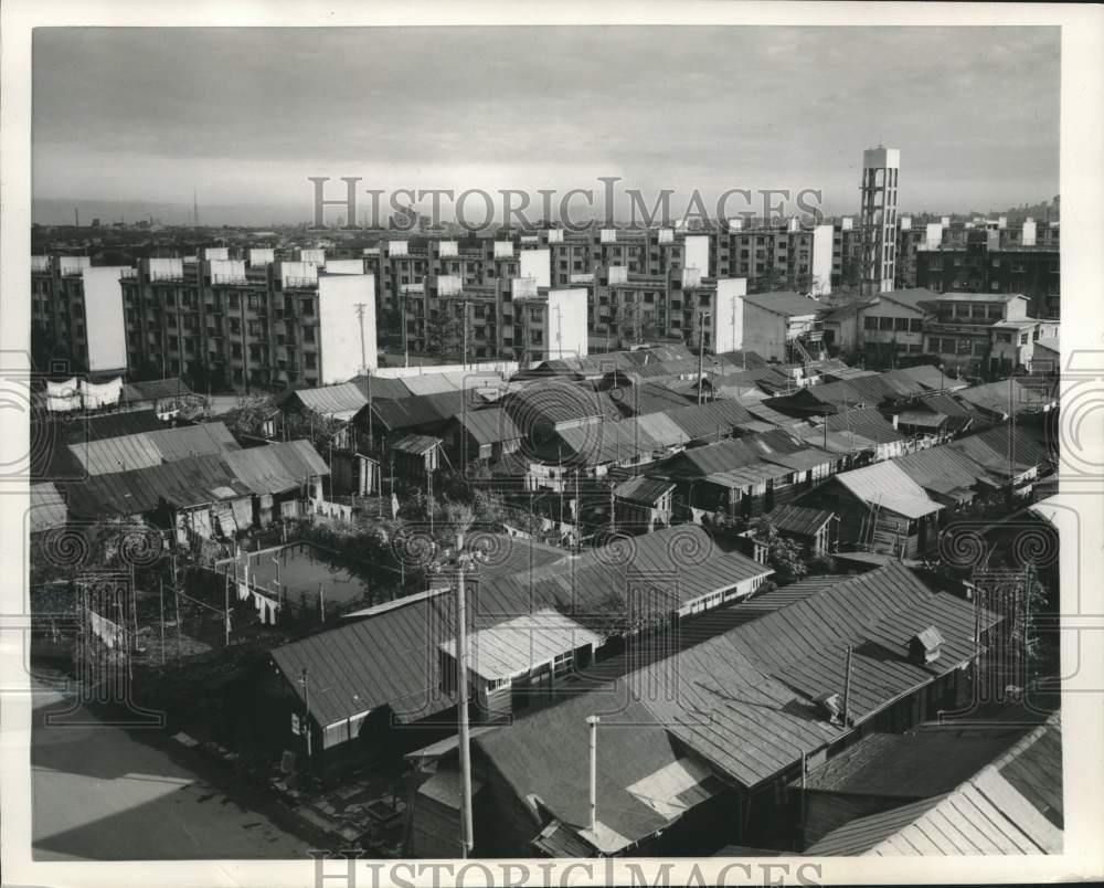 1954 Press Photo Wooden Houses and Concrete Apartment Complexes in Tokyo, Japan - Historic Images