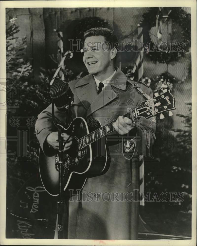 1957 Press Photo Ozzie Nelson singe on an episode of his television show - Historic Images