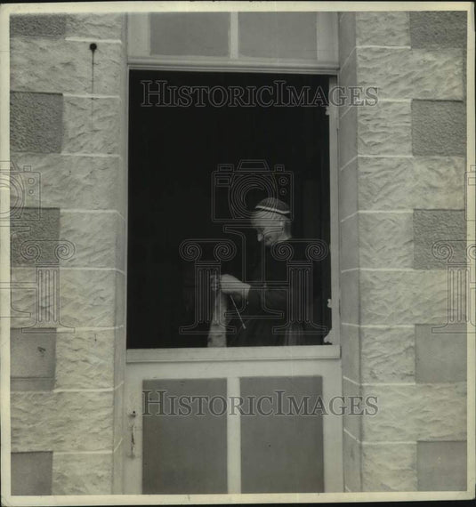 1939 Woman knits in her doorway in Brittany, France - Historic Images