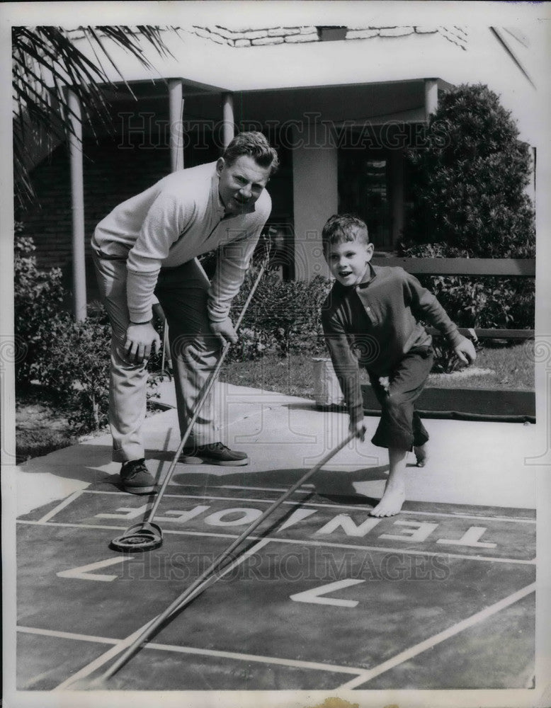 1960 New York Yankees Pitcher Whitey Ford playing games with his son - Historic Images