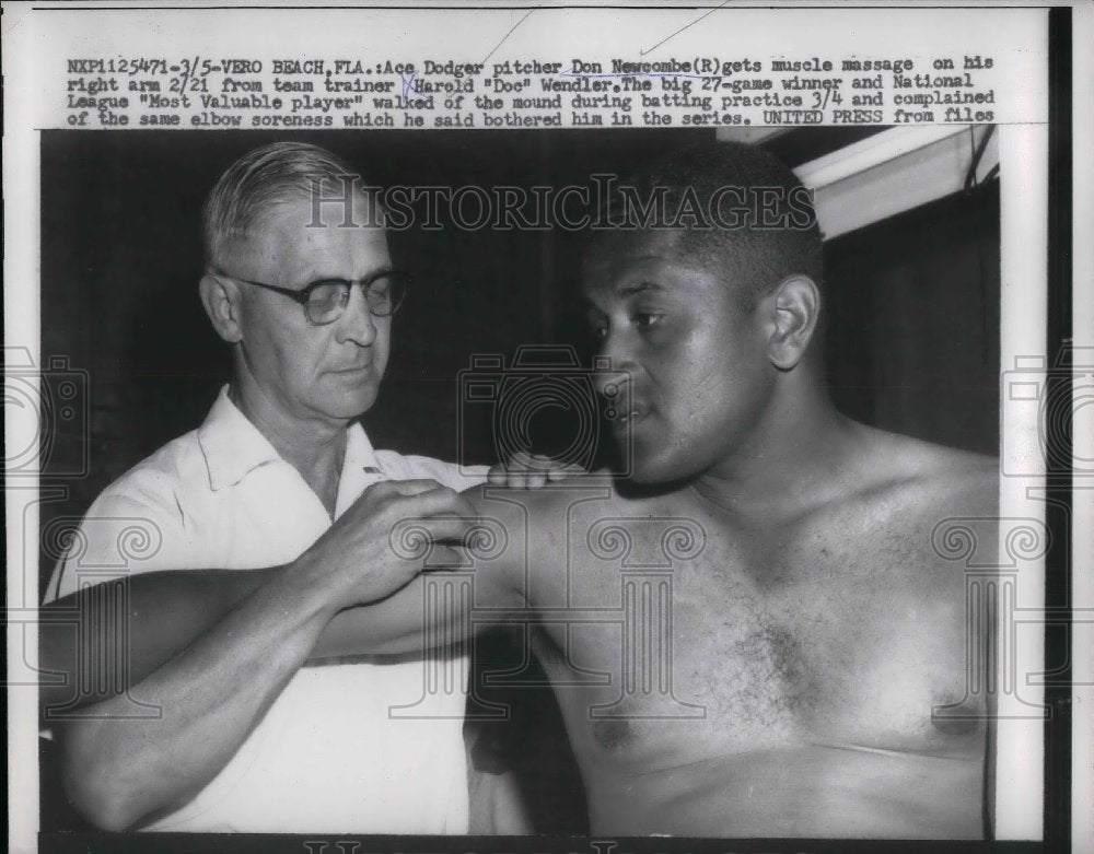 1957 Dodger Pitcher Don Newcombe, team trainer Harold "Doc" Wendler - Historic Images