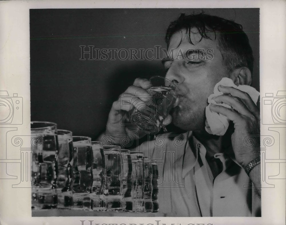 1949 Man Drinks - Historic Images