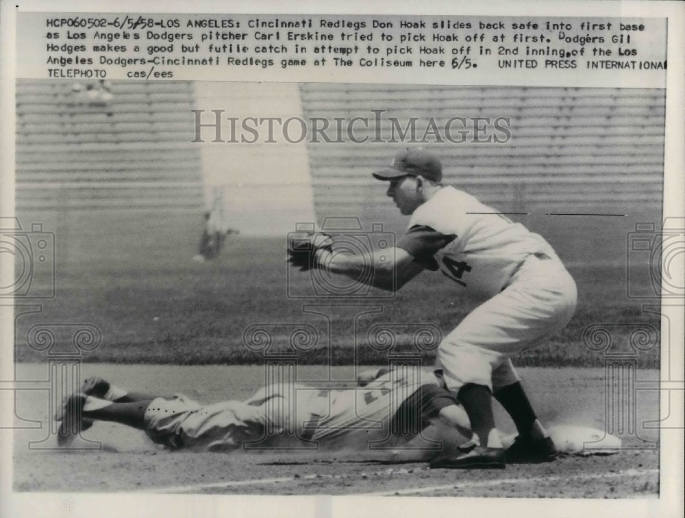 1958 Press Photo Cincinnati Redlegs Don Hoak Slides Safe Back To 1st Base-Historic Images