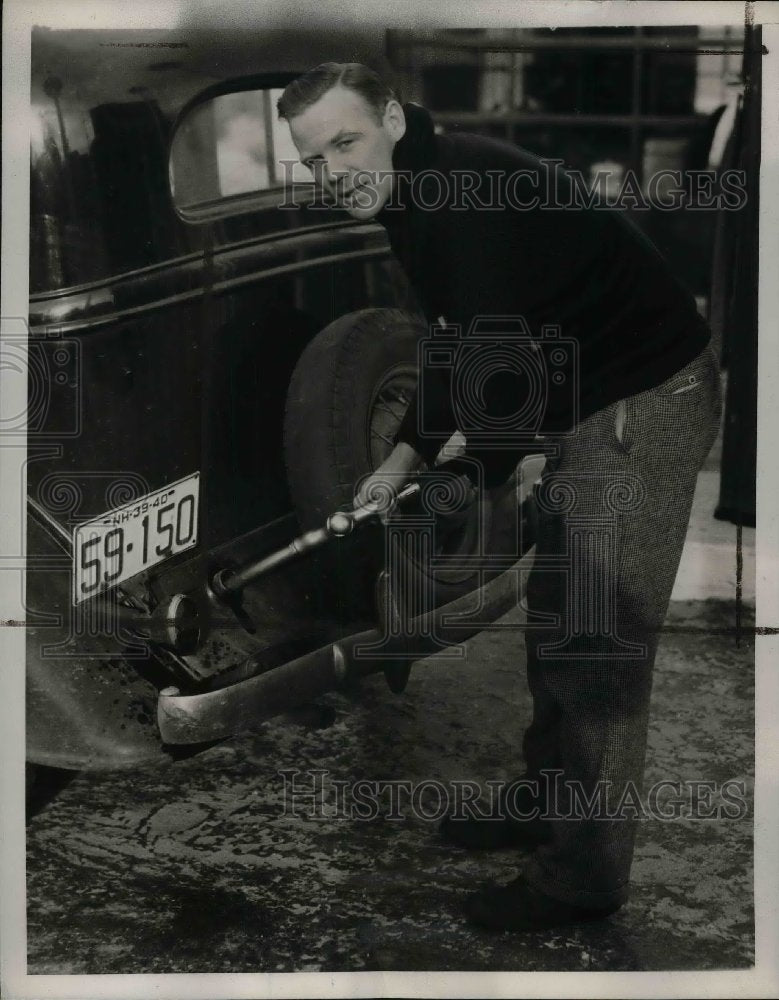 1940 Red Rolfe, Yankee 3rd baseman, pumps gas at his filling station - Historic Images