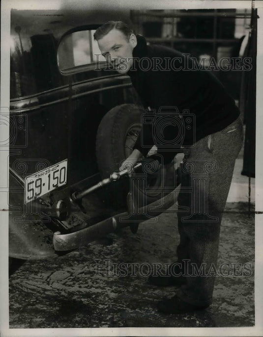 1940 Red Rolfe, Yankee 3rd baseman, pumps gas at his filling station - Historic Images