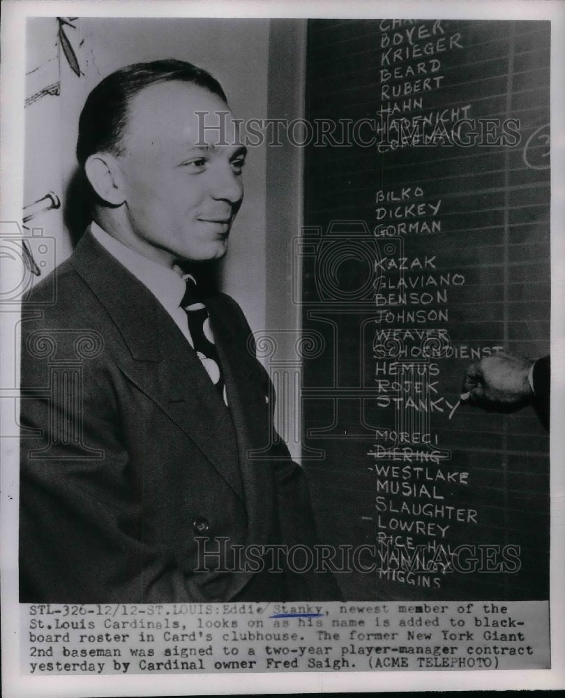 1951 Eddie Stanky looking at St.Louis Cardinals Clubhouse Board. - Historic Images