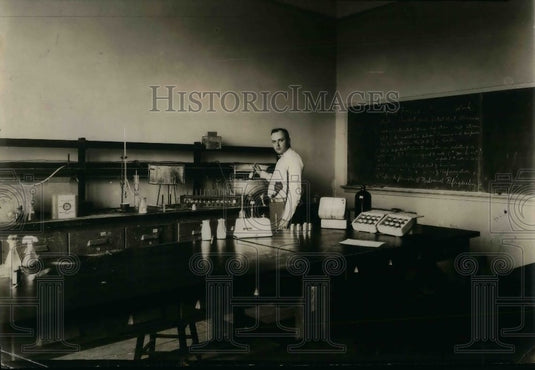 1930 Press Photo Chemist K.M. Renner testing a first Cow's Milk. - nea09953 - Historic Images
