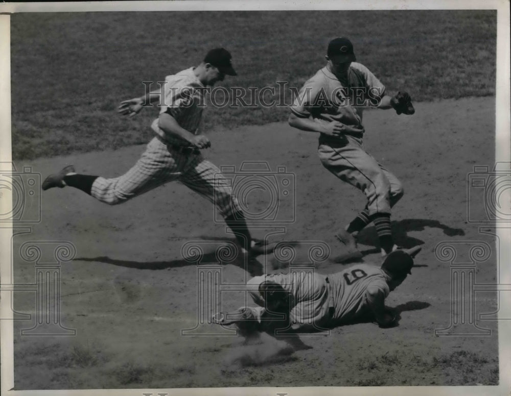 1943 Press Photo Indians Mike Rocco slides to 1st vs Yankees Bill Johnson - Historic Images