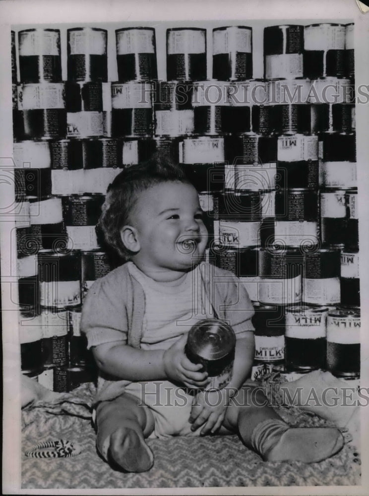 1945 Baby Rikki Rodzinski, with the collection of Canned milk. - Historic Images