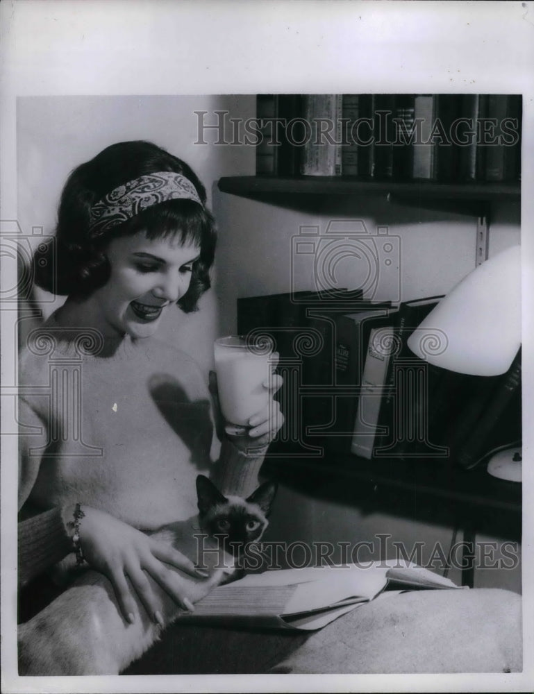 1958 Press Photo Teen-agers sips milk between meals - nea10809 - Historic Images