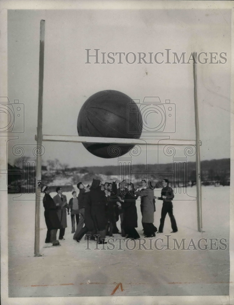 1932 University of Miami playing with big ball on football field - Historic Images
