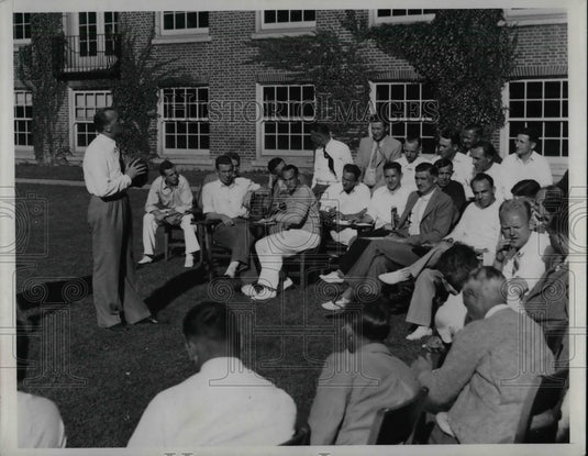 1935 Joel Sutherland Holding football at school - Historic Images